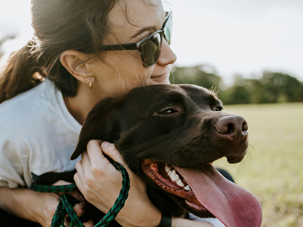 adoption-process_3h Woman hugging her dog
